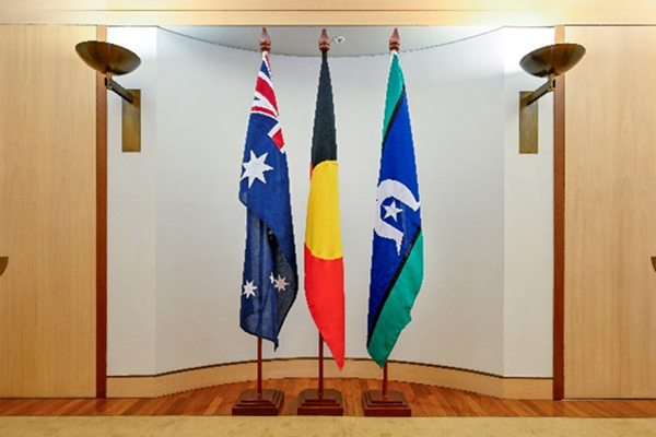 Three flagpoles of equal height in a row. Three flagpoles of equal height in a row.