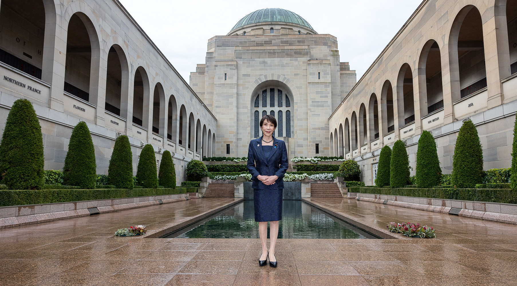 Prime Minister of Japan Sanae Takaichi stands in the courtyard at the Australian War Memorial.