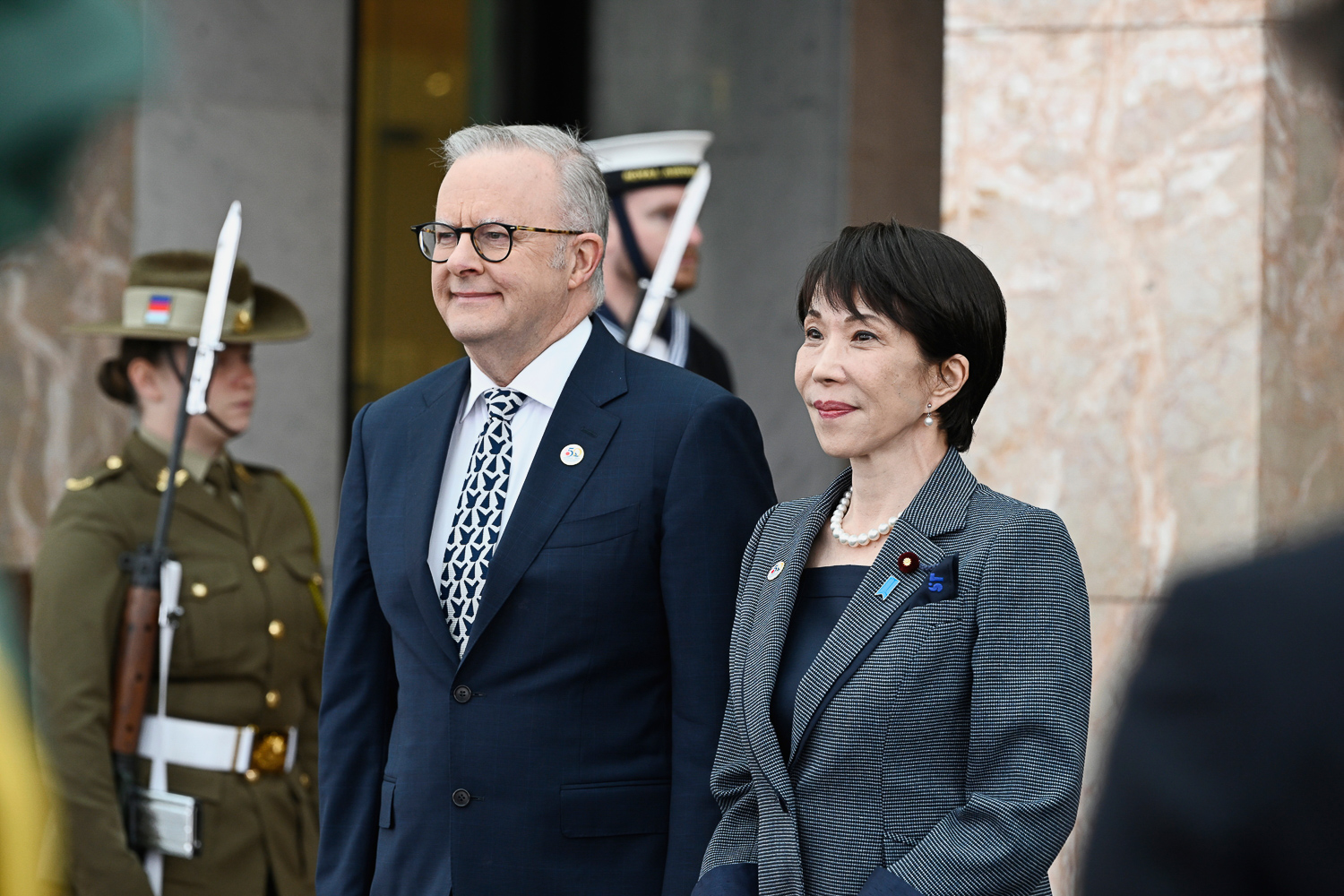 Prime Minister Anthony Albanese and Prime Minister of Japan Sanae Takaichi stand together during an official welcome ceremony.