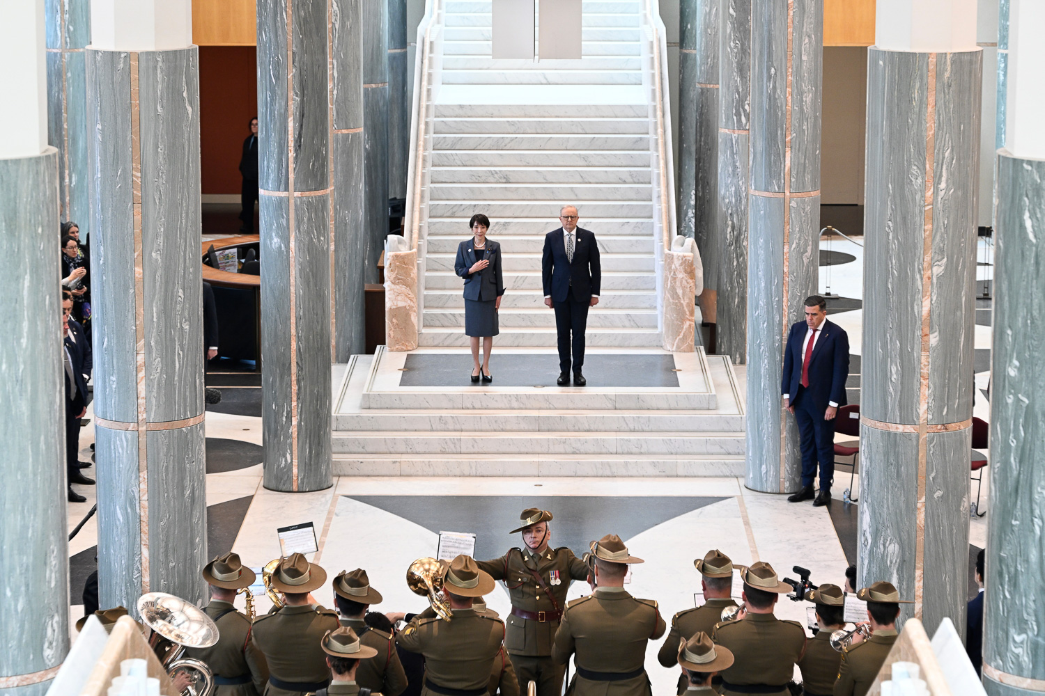 Prime Minister Anthony Albanese and Prime Minister of Japan Sanae Takaichi walk through a ceremonial hall during an official event.