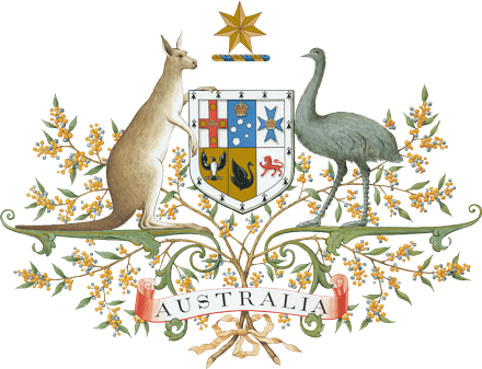 A kangaroo at left and an emu at right support a five sided plaque with images of a cross, a bird, a swan, a lion and more between them. They stand on supports with flowering branches all around them. Above the plaque is a star and below the word: Australia.