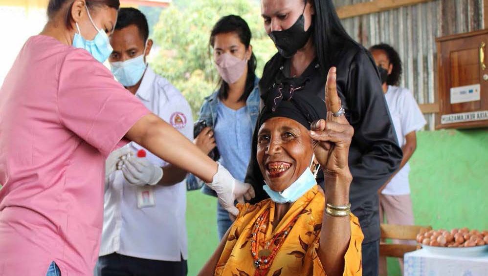 A woman gets vaccinated in Ainaro municipality, Timor-Leste. Australia shares doses with regional partners such as Timor-Leste as part of its commitment to vaccine equity.