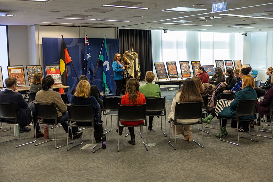 Ngunnawal Elder Serena Williams presenting to a group of people at the storytelling event at during NAIDOC Week at PM&C.