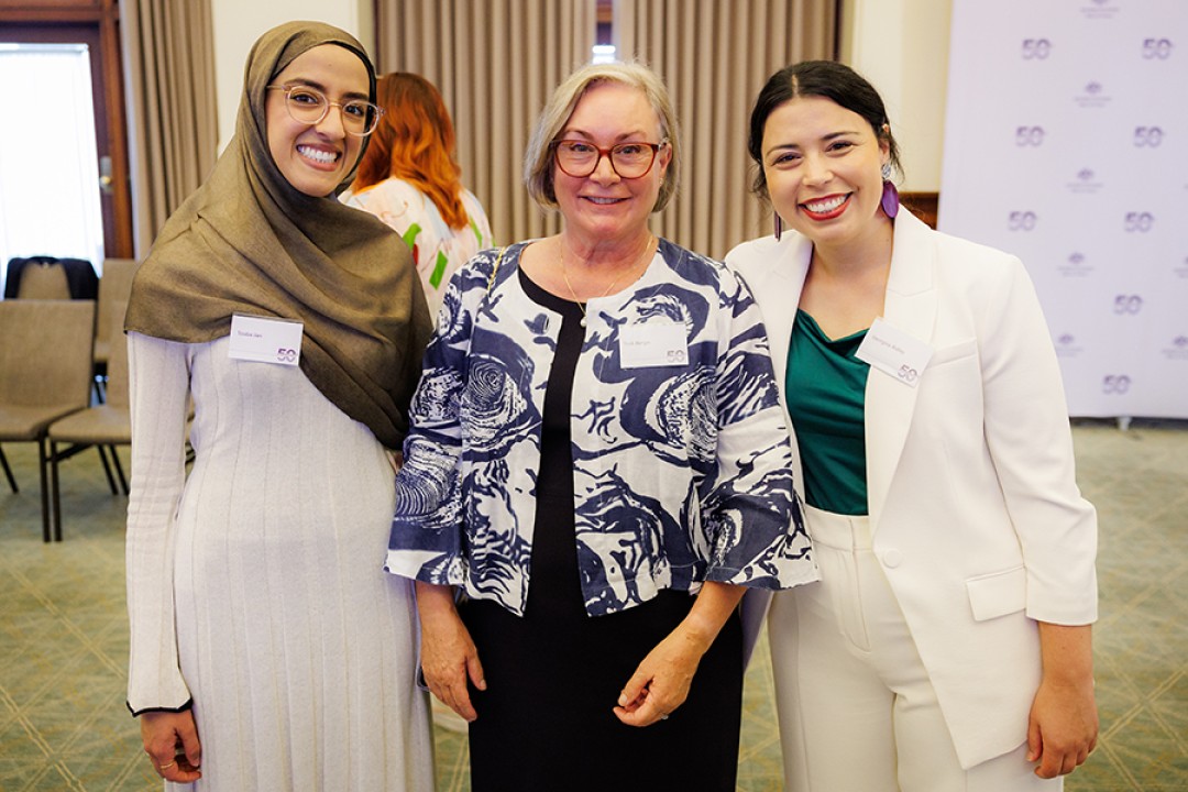 Tooba Jan, Trish Bergin and Georgina Ridley pose for a group photograph while attending an event celebrating the Office for Women’s 50th anniversary.
