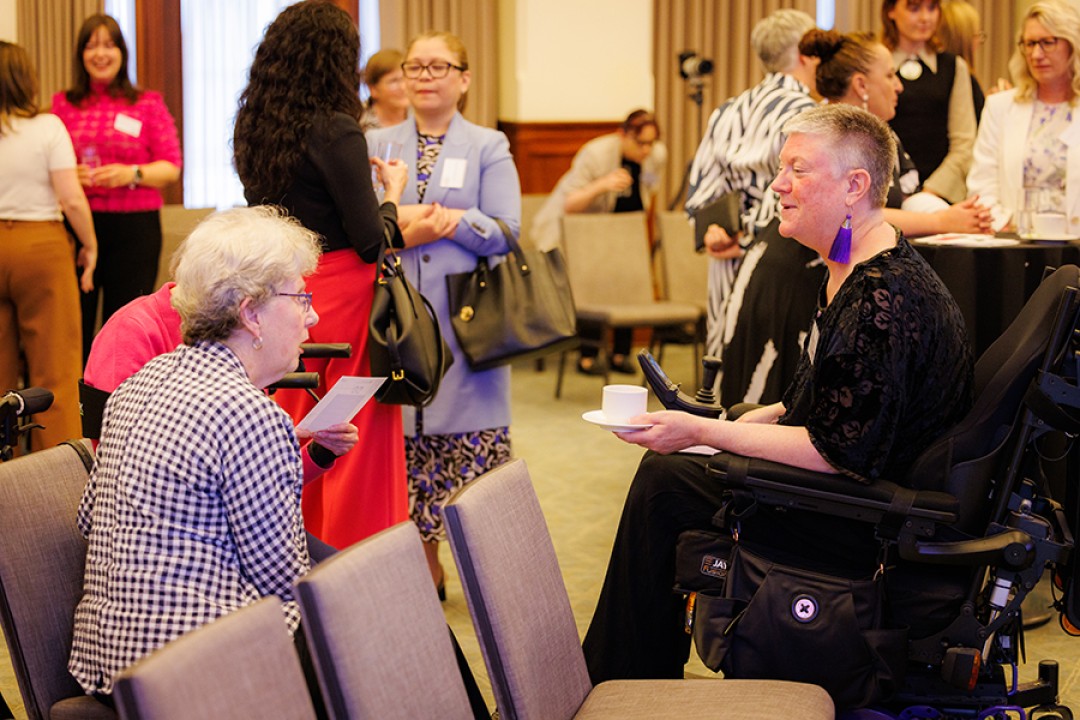 Elizabeth Reid AO and Christina Ryan chat informally an event celebrating the Office for Women’s 50th anniversary.