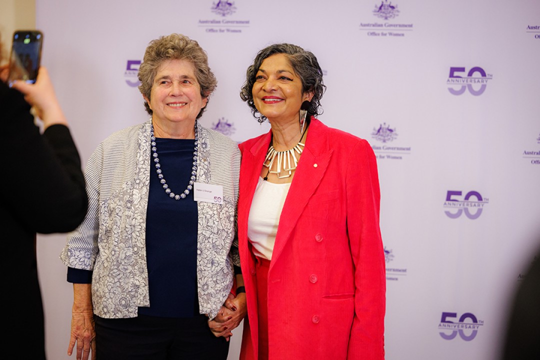 Helen L'Orange AM and Padma Raman PSM posing for a photograph while attending an event celebrating the Office for Women’s 50th anniversary.