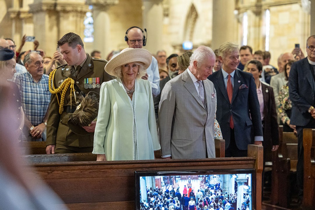 Their Majesties in the front pews at the St Thomas' Anglican Church. Every pew is filled.