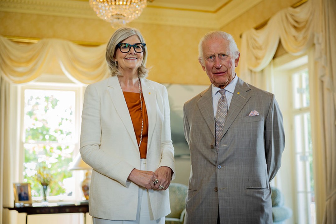 His Majesty and Her Excellency the Hon Sam Mostyn AC stand posing for the camera.