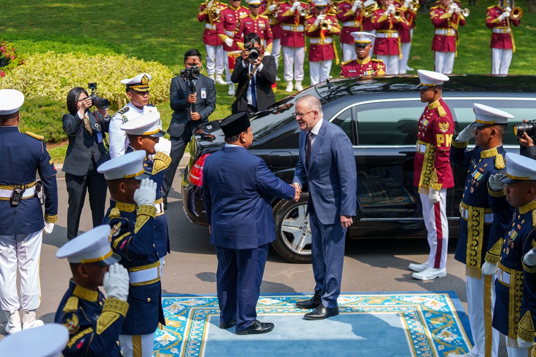 Indonesian President Prabowo Subianto greets Prime Minister Anthony Albanese in Jakarta.
