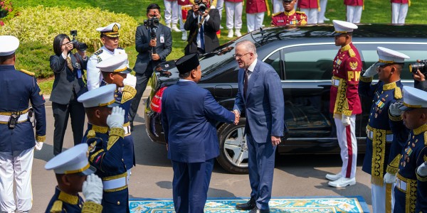 Indonesian President Prabowo Subianto greets Prime Minister Anthony Albanese in Jakarta.