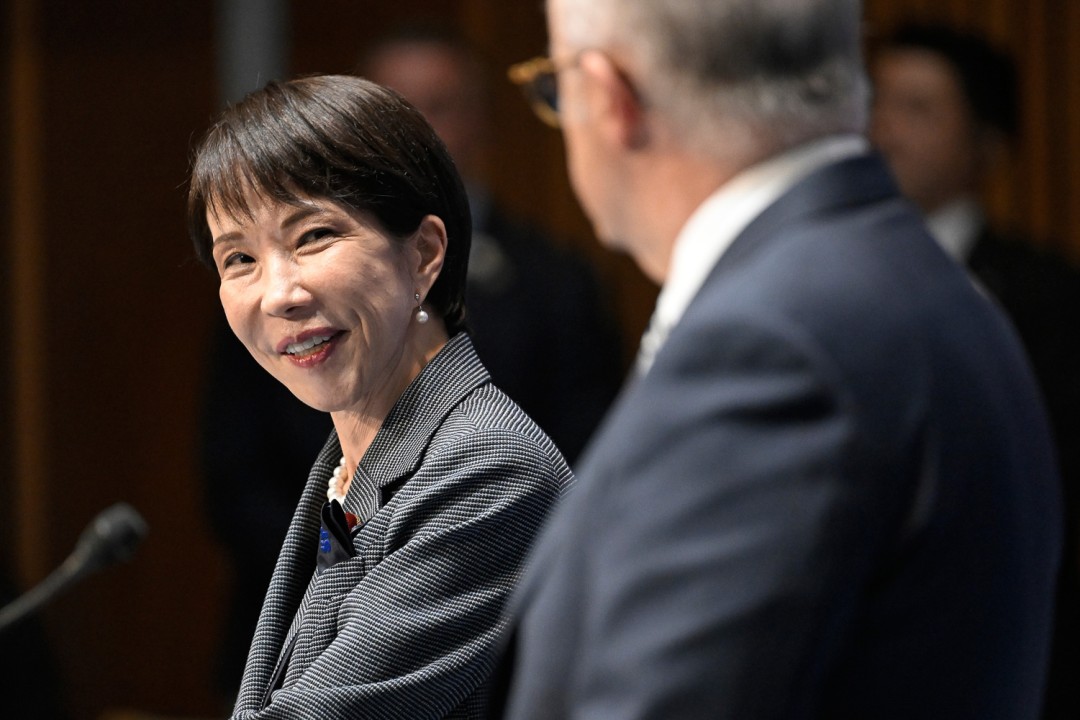Prime Minister of Japan Sanae Takaichi smiles during bilateral talks with Prime Minister Anthony Albanese in the foreground.
