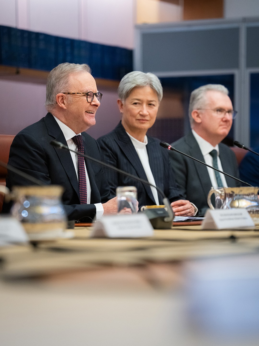 Prime Minister Anthony Albanese, General Secretary and President of the Socialist Republic of Vietnam To Lam and another official sit at a conference table during a meeting at Australian Parliament House.