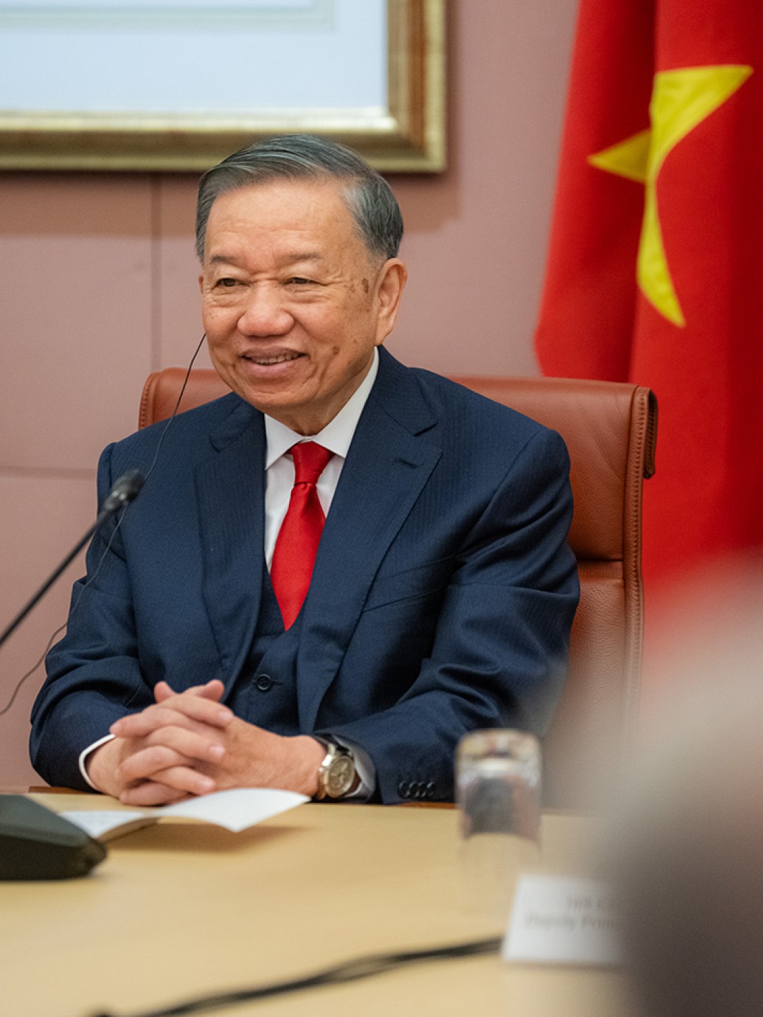 General Secretary and President of the Socialist Republic of Vietnam To Lam sits at a conference table during a meeting at Australian Parliament House, with a Vietnamese flag in the background.