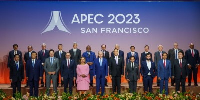 Australian Prime Minister Anthony Albanese stands with APEC leaders in front of a backdrop that says ‘APEC 2023 San Francisco’.