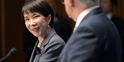 Prime Minister of Japan Sanae Takaichi smiles during bilateral talks with Prime Minister Anthony Albanese in the foreground.