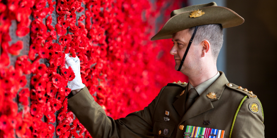 Australian Army Captain Dean Varian, Operations Officer of Australia's Federation Guard places a poppy for his great uncle Theo on the Roll of Honour at the Australian War Memorial, Canberra, ACT, 1 October 2019.