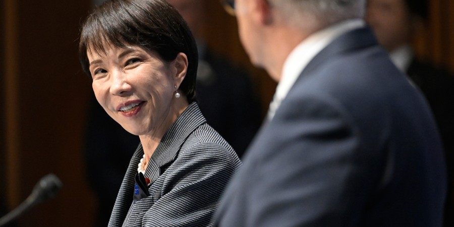 Prime Minister of Japan Sanae Takaichi smiles during bilateral talks with Prime Minister Anthony Albanese in the foreground.